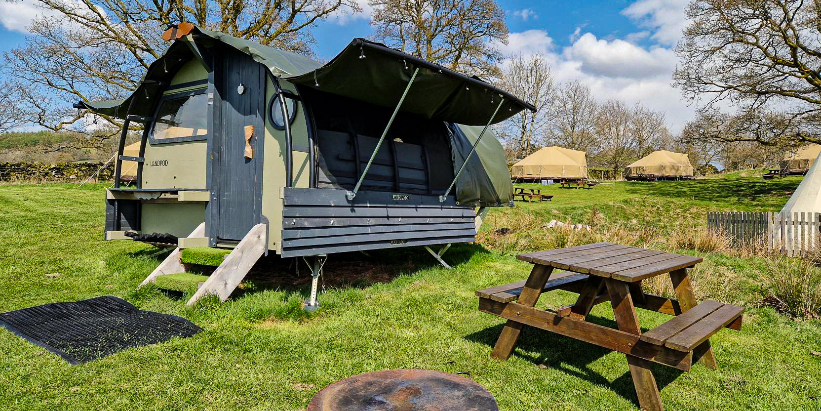 Landpod with bench and firepit at YHA Windermere