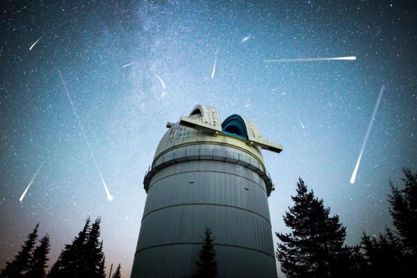 Astronomical Observatory with asteroids and comets in night sky