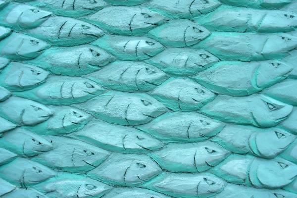 An arty fish textured facade outside a cornish fishmarket in Cornwall