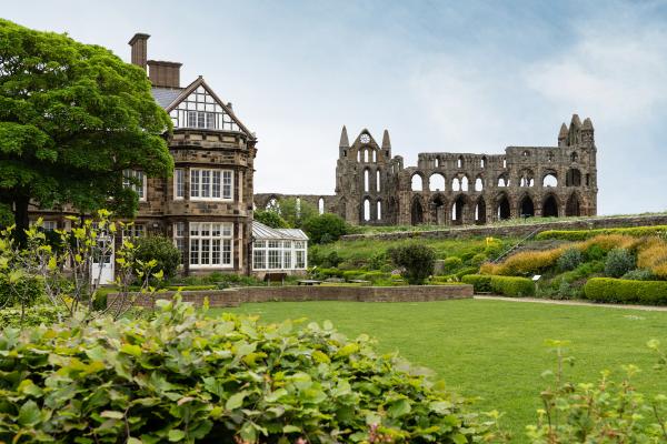 Exterior of YHA Whitby with Whitby Abbey in the background
