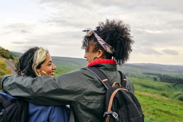 Two women walking in the countryside