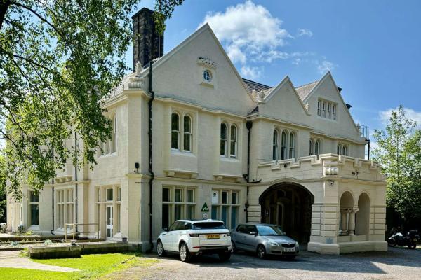 Large stone building painted white