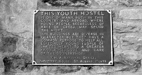A plaque describing the diversity of hostels