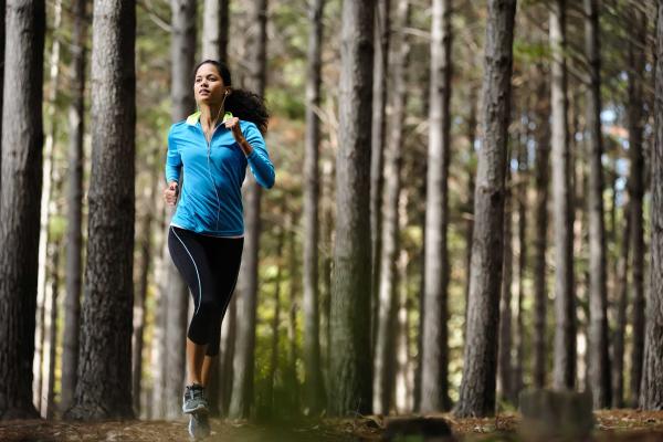 Women running through the woods