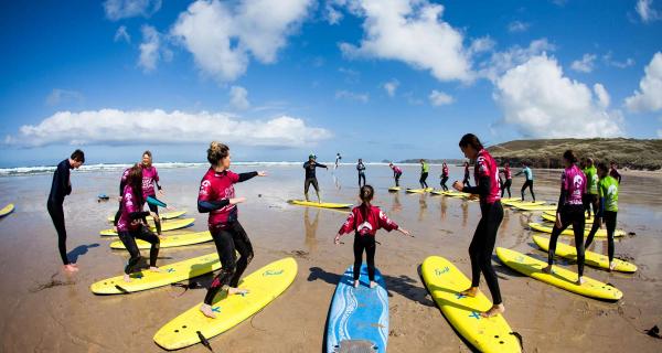 Young people practising surfing