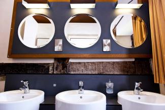 Sinks and mirrors in the shared bathroom YHA Wilderhope Manor bathroom