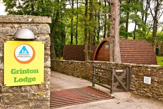 Welcome sign and entrance YHA Grinton Lodge Exterior