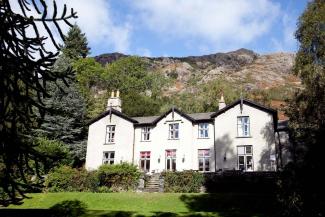 Hostel view and gardens at YHA Coniston Holly How YHA Coniston Holly How External Image