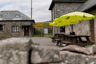 Outdoor seating area in YHA Dartmoor courtyard YHA Dartmoor external seating