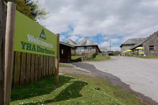 Entrance to YHA Dartmoor with welcome sign YHA Dartmoor exterior
