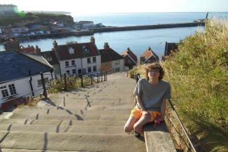 Boy at the top of the Whitby steps Boy at the top of the Whitby steps