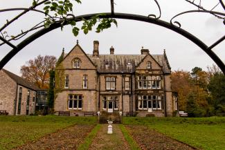 Gardens and hostel building at YHA Castleton Losehill Hall YHA Castleton exterior