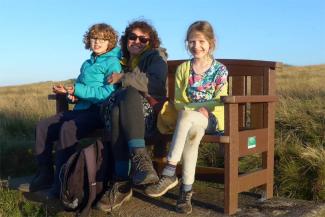 Family sitting on a bench on the North Yorkshire Moors