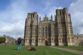 Father and two children outside Wells cathedral