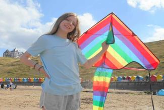 Girl with kite on Westcliff beach, Whitby Girl with kite on Westcliff beach, Whitby