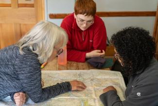 Group of people reading a map