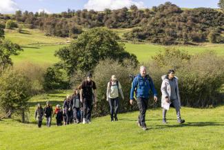 People walking in the Hartington countryside