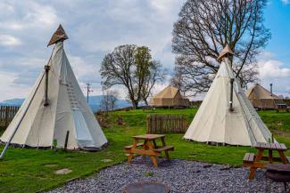 Tipis at YHA Windermere with seating area
