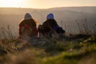 Two women enjoying a sunrise view