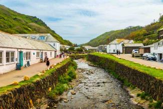 Rows of white painted houses leading to the sea