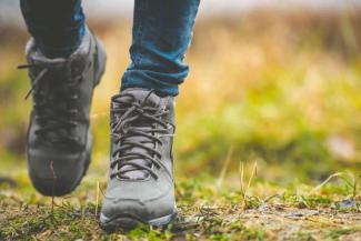 Pair of walking boots in a field