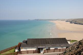 View of YHA Perranporth exterior with beach view