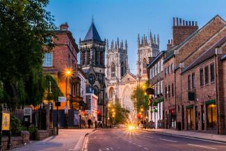 Road leading to historic buildings including a the York Minster cathedral