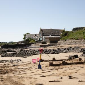 YHA Port Eynon exterior view with beach