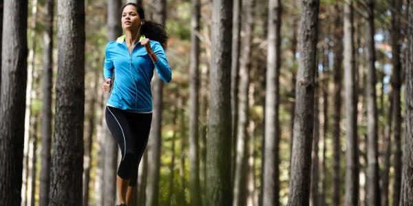 Woman running in the woods