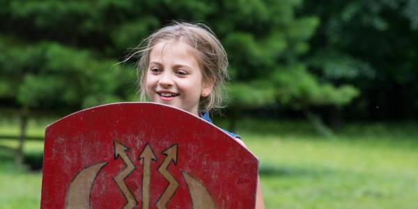 Child holding a shield 