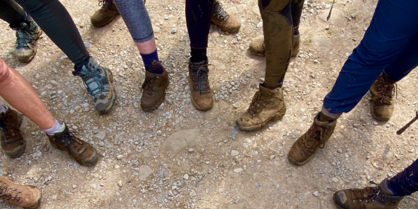 Group of walkers showing their shoes on the ground