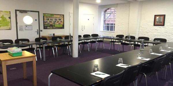 Meeting room at YHA Bristol with u-shaped table configuration and chairs