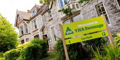 Welcome sign outside YHA Swanage YHA Swanage sign
