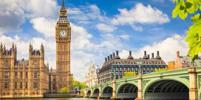 View of Big Ben and London Bridge over the Thames Clocktower of Big Ben and a green bridge over the river Thames