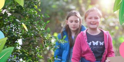 Children walking through countryside on a sunny day