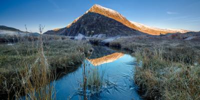 View of Eryri (Snowdonia) with icy stream