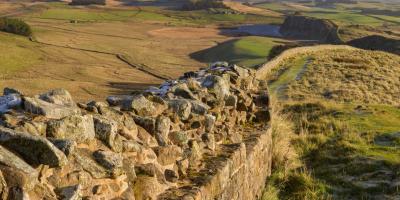 Stone wall winding through the countryside
