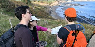 People looking at a self-guided walking map