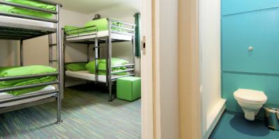 Bedroom with two sets of bunk beds and an adjoining en-suite bathroom