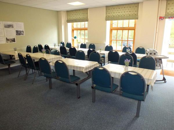 Light, airy room with rows of tables and chairs