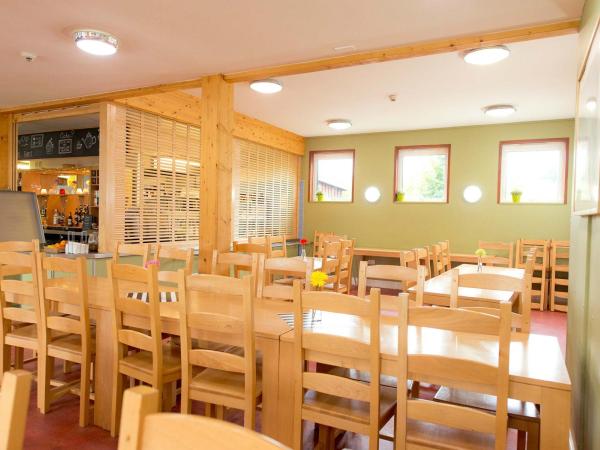 Dining room with wooden tables and chairs