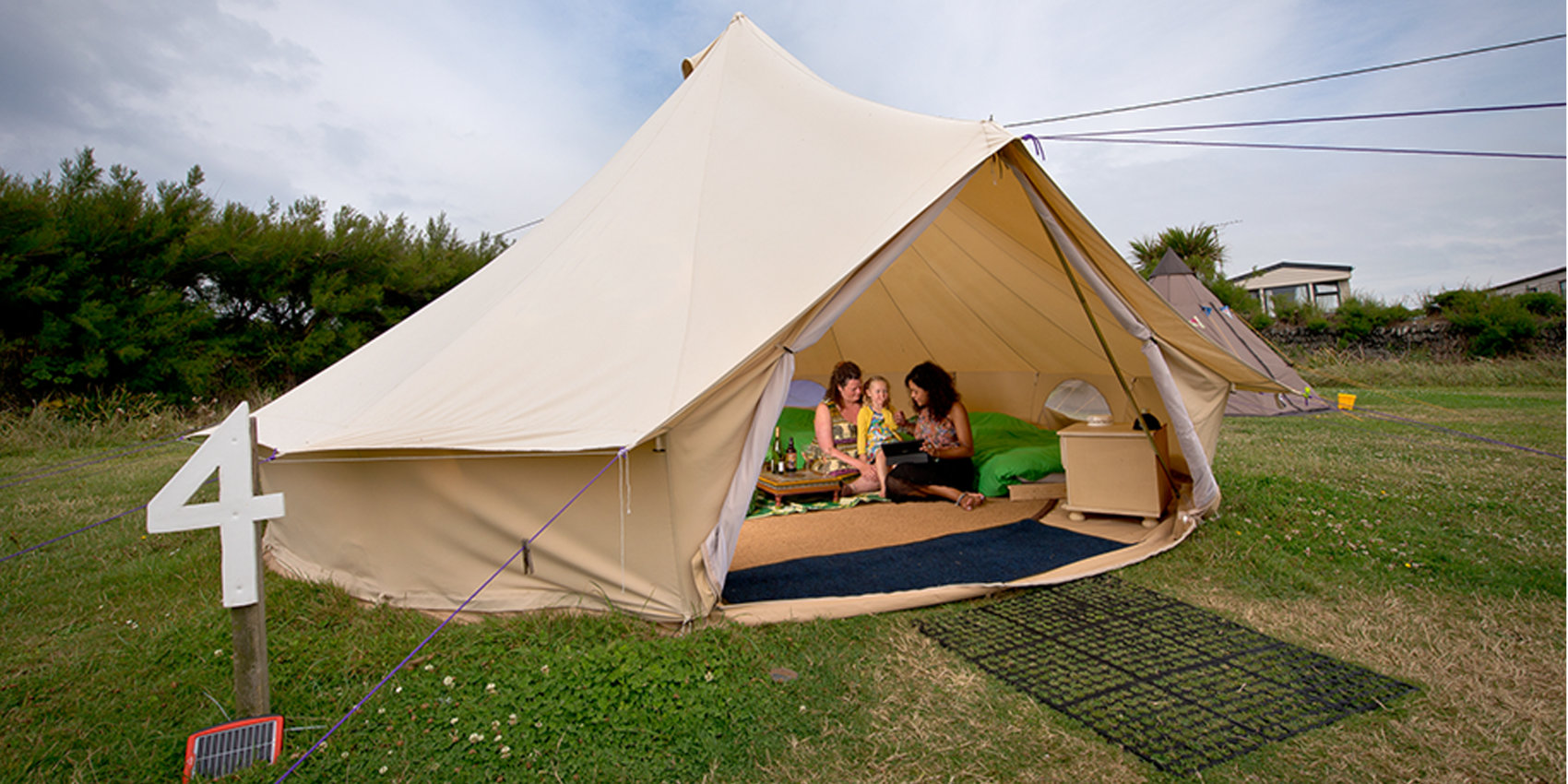 Family enjoying their bell tent at YHA