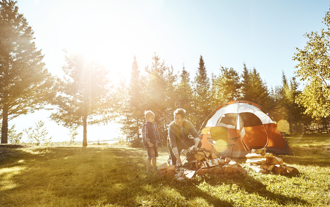 Man and boy camping