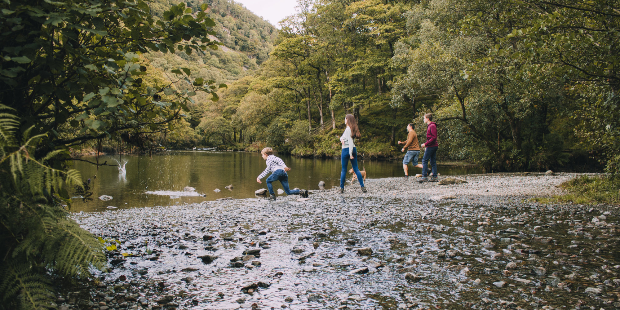 Group skimming stones in the Lake District