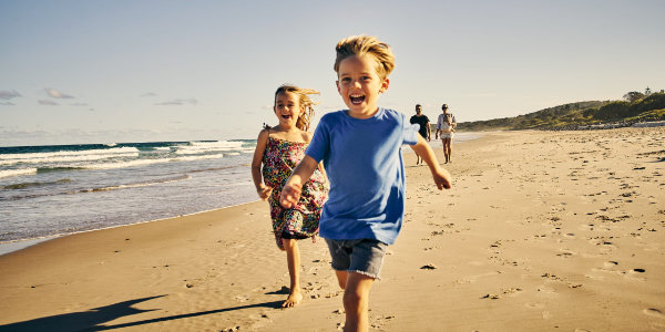 Children running on a beach