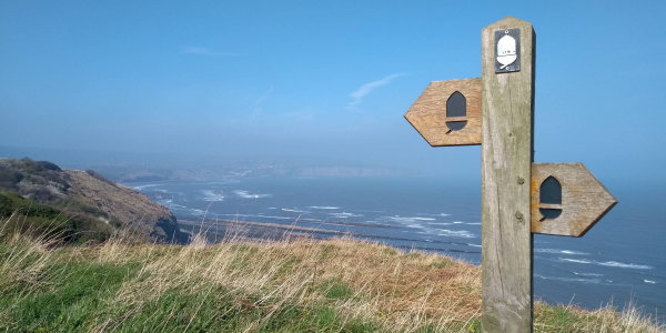 Sign on a coastal path