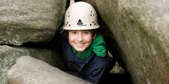 Child rock climbing with YHA